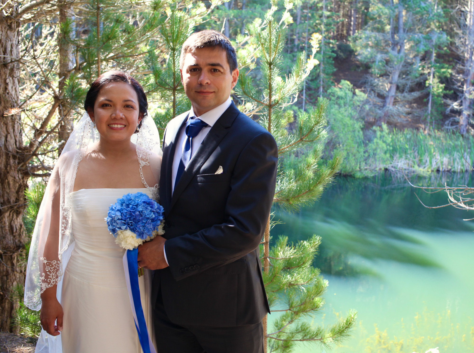 wedding couple by lake